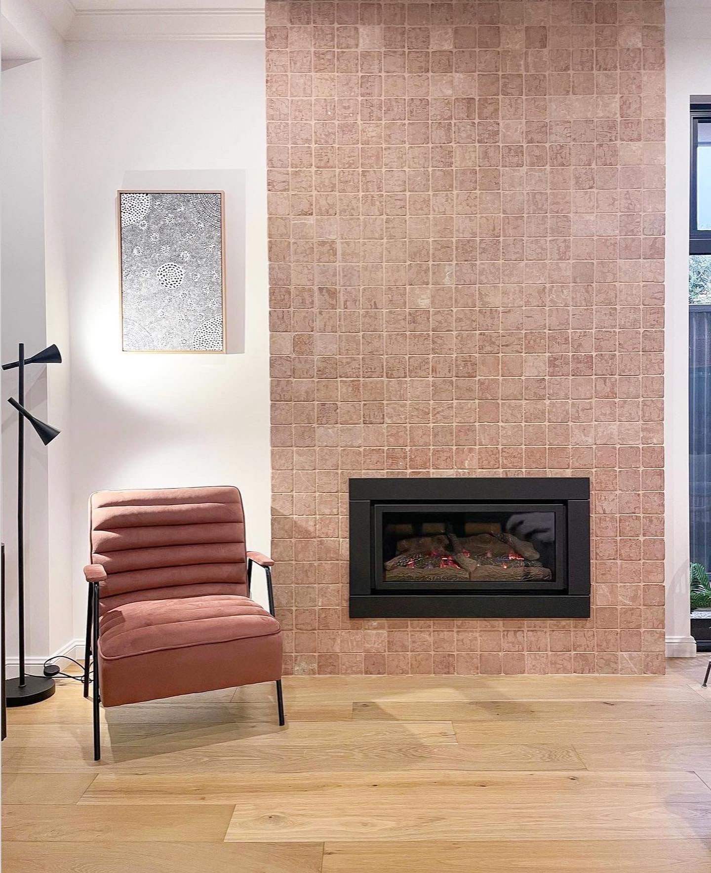 Illusion gas log fireplace installed as the centrepiece of a modern living room