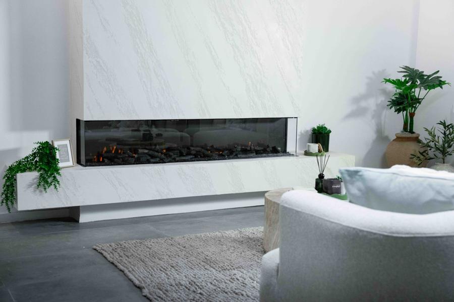 Velisse Aura 3-sided electric fireplace in a white feature wall